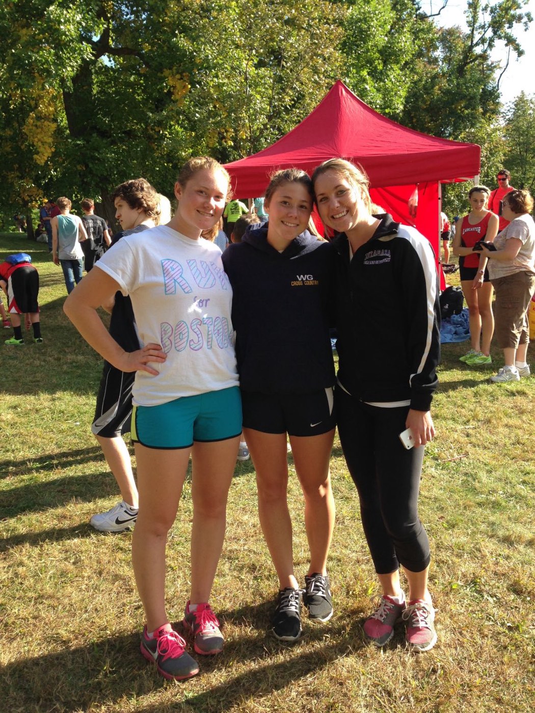 Three friends at a cross country meet